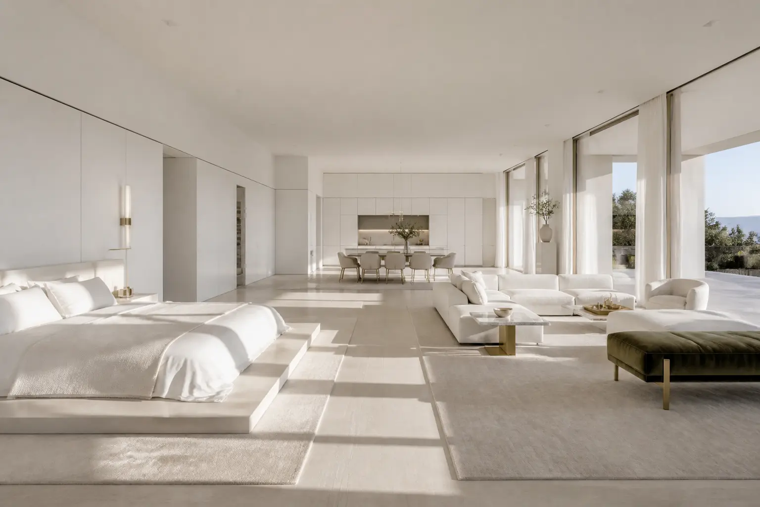Large minimalist white open-plan bedroom suite with platform bed, sitting area, dining table and kitchen